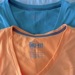Nike woman dry fit v-neck shirts, orange and teal green